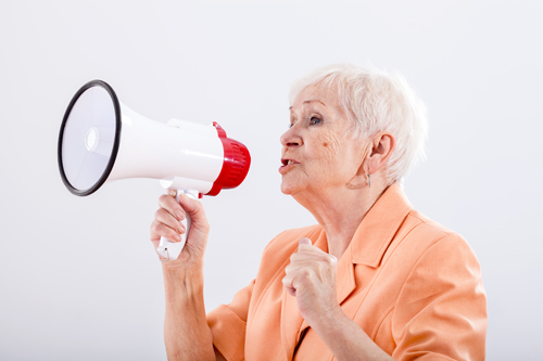 An elegant grandma talking through a megaphone