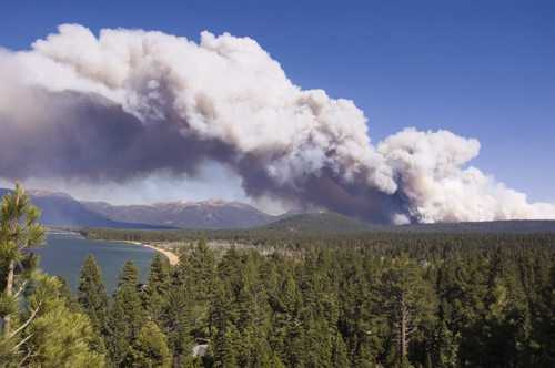 A spectacular cloud of smoke rises from the Angora forest fire in south Lake Tahoe, California, on June 24, 2007. Dry conditions and a strong wind combined to produce a dramatic smoke cloud against a clear blue sky.