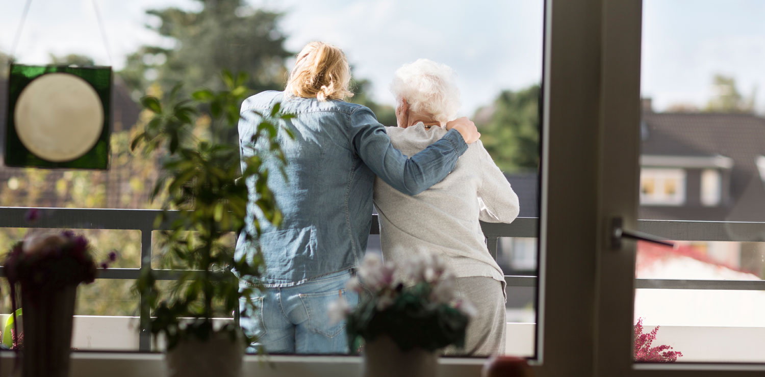 Mother wrapping her arm around mother